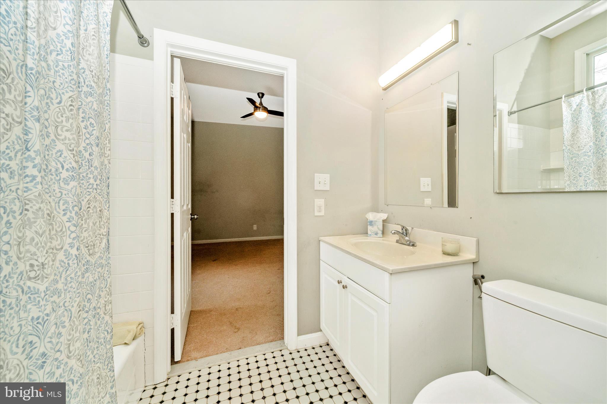 3313 Moline Road Silver Spring, MD 20902 - Photo 37 of 66 a bathroom with a sink a toilet and shower