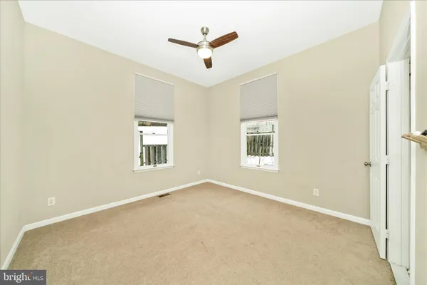 a view of a balcony with wooden floor