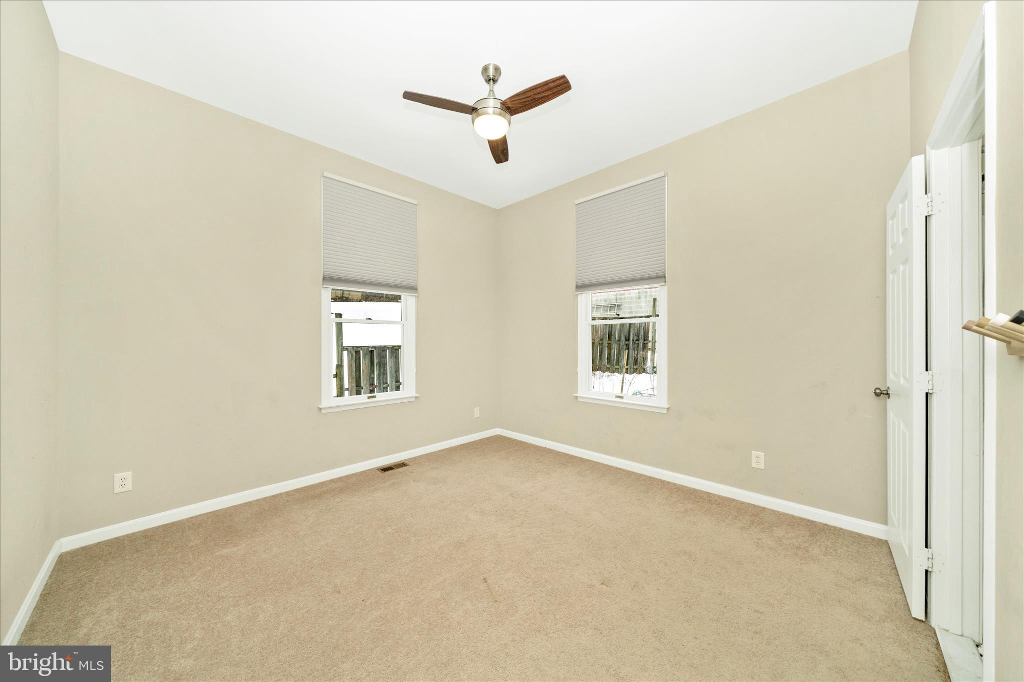 3313 Moline Road Silver Spring, MD 20902 - Photo 40 of 66 a view of a livingroom with a ceiling fan and window