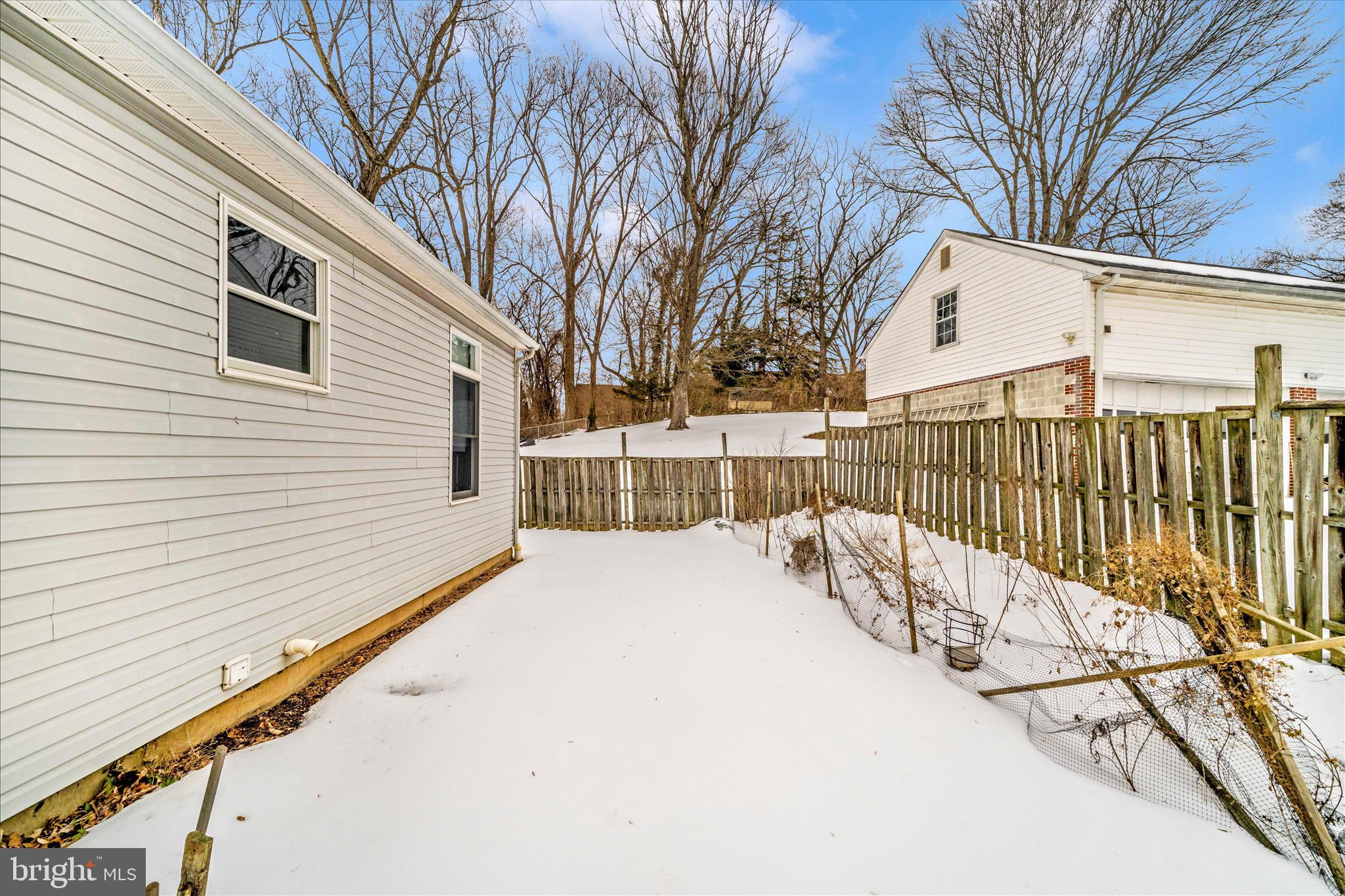 3313 Moline Road Silver Spring, MD 20902 - Photo 51 of 66 a view of a white building with wooden fence