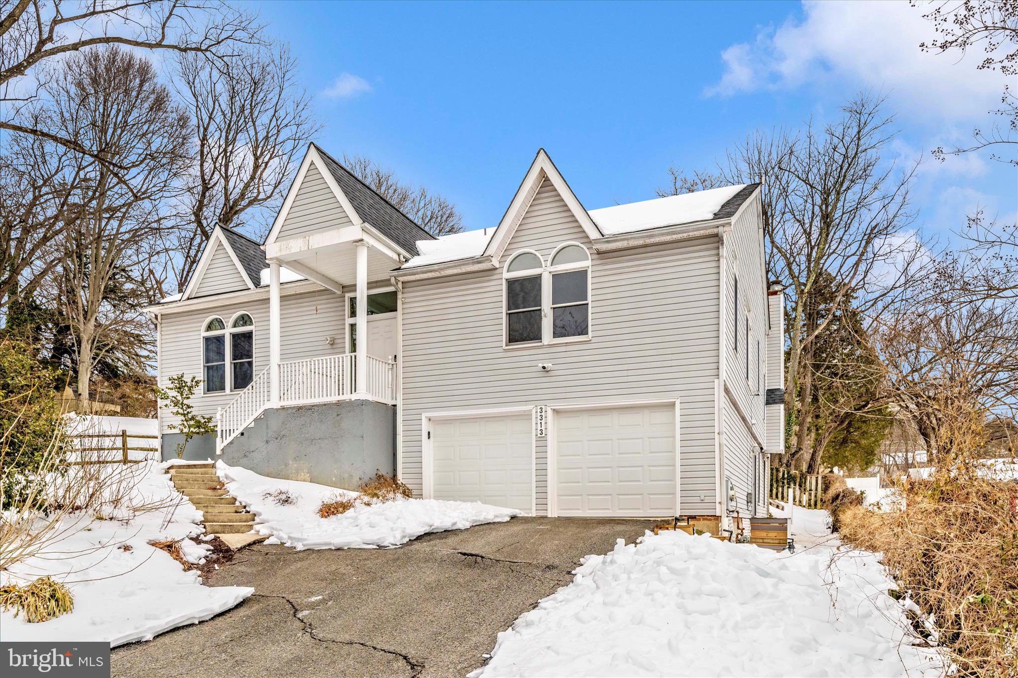 3313 Moline Road Silver Spring, MD 20902 - Photo 55 of 66 a view of a white house with a yard and garage