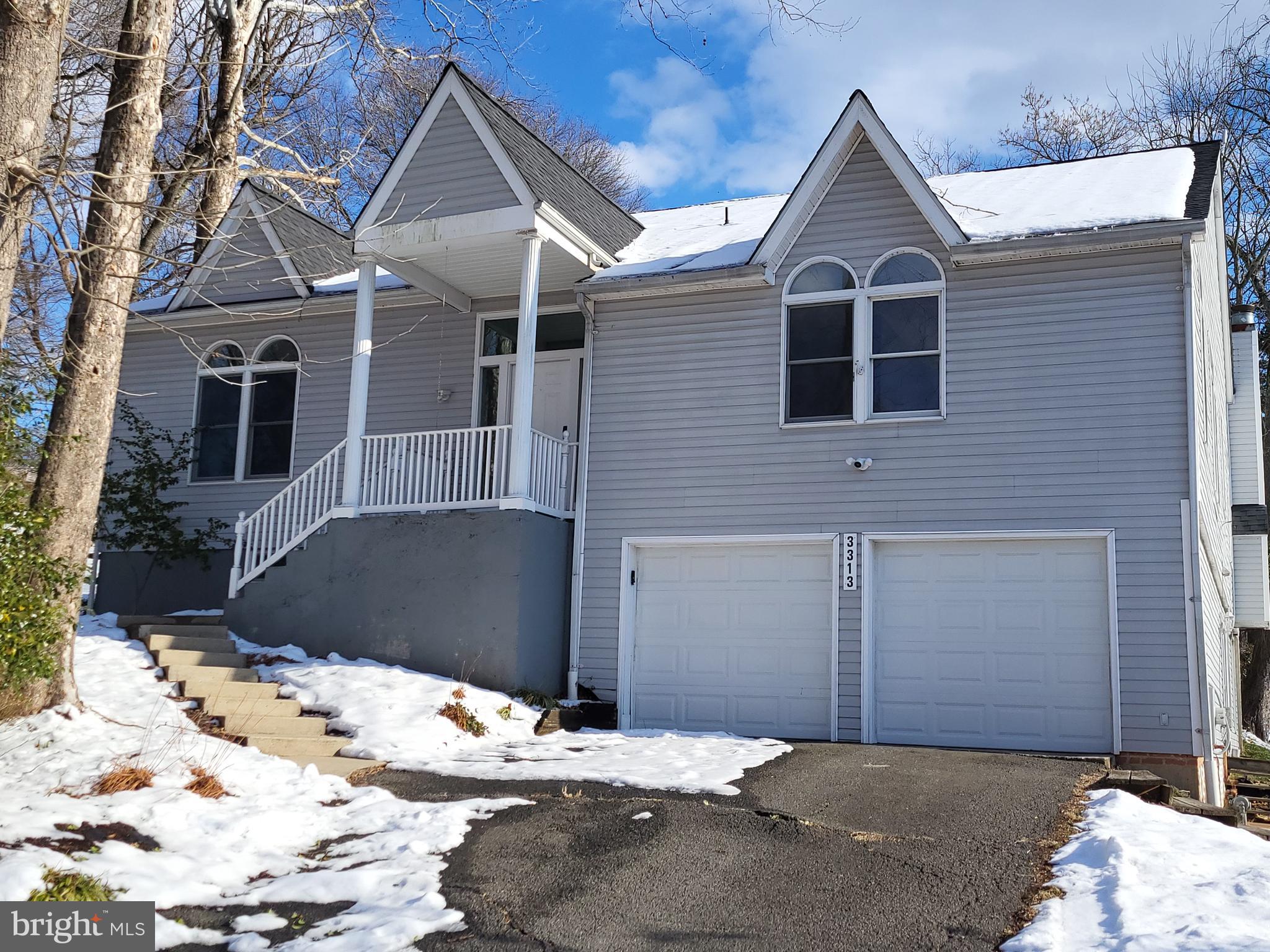 3313 Moline Road Silver Spring, MD 20902 - Photo 62 of 66 a view of a house with snow on the road