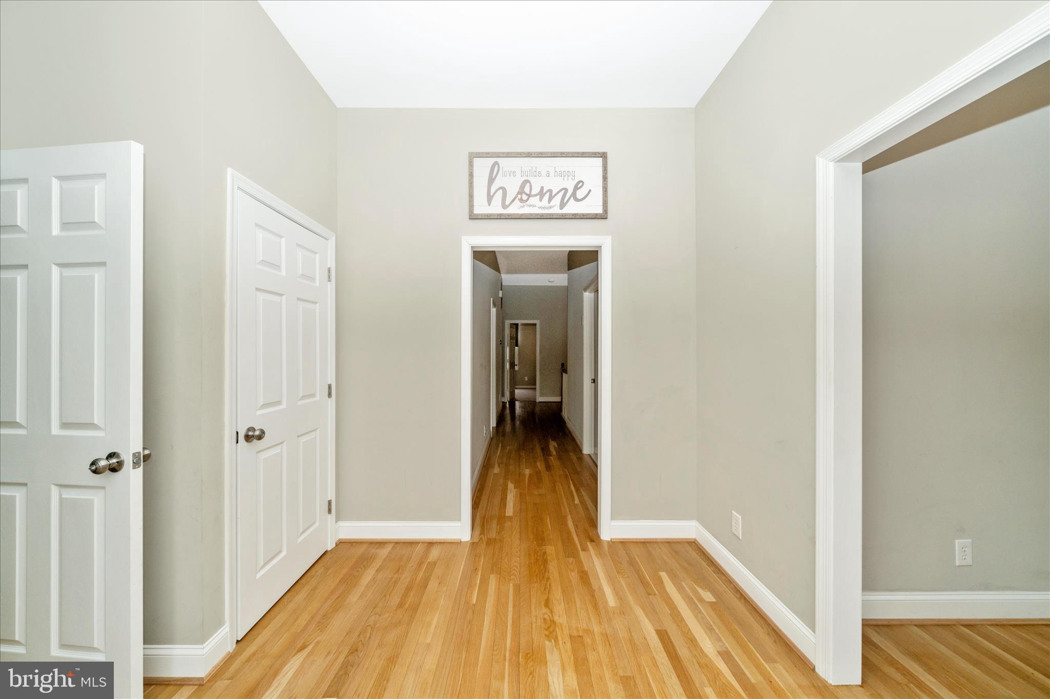 3313 Moline Road Silver Spring, MD 20902 - Photo 8 of 66 a view of a hallway view with wooden floor and staircase