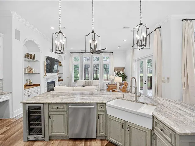 a large kitchen with cabinets and a stove