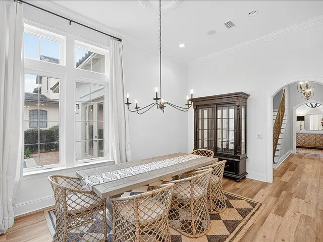 a large white bed in a white room