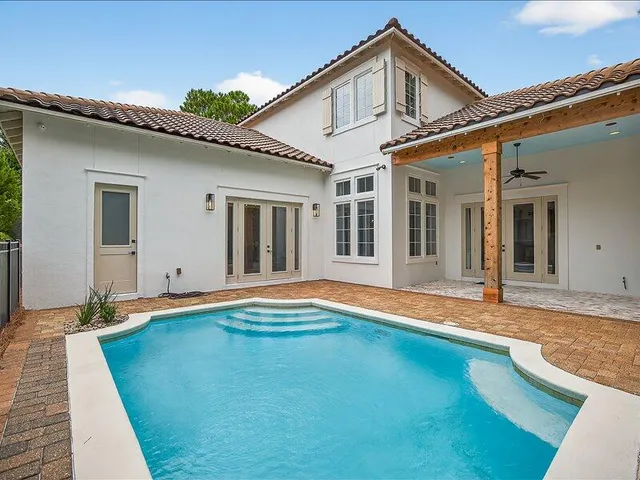 a view of a house with a swimming pool
