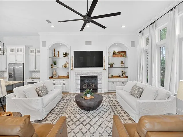 a living room with furniture fireplace and a flat screen tv