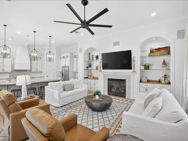a living room with furniture fireplace and a flat screen tv