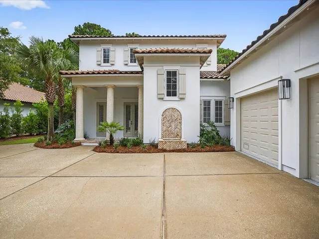 a kitchen with granite countertop white cabinets and stainless steel appliances