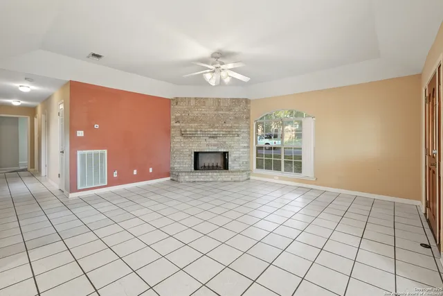 a view of an empty room with glass door