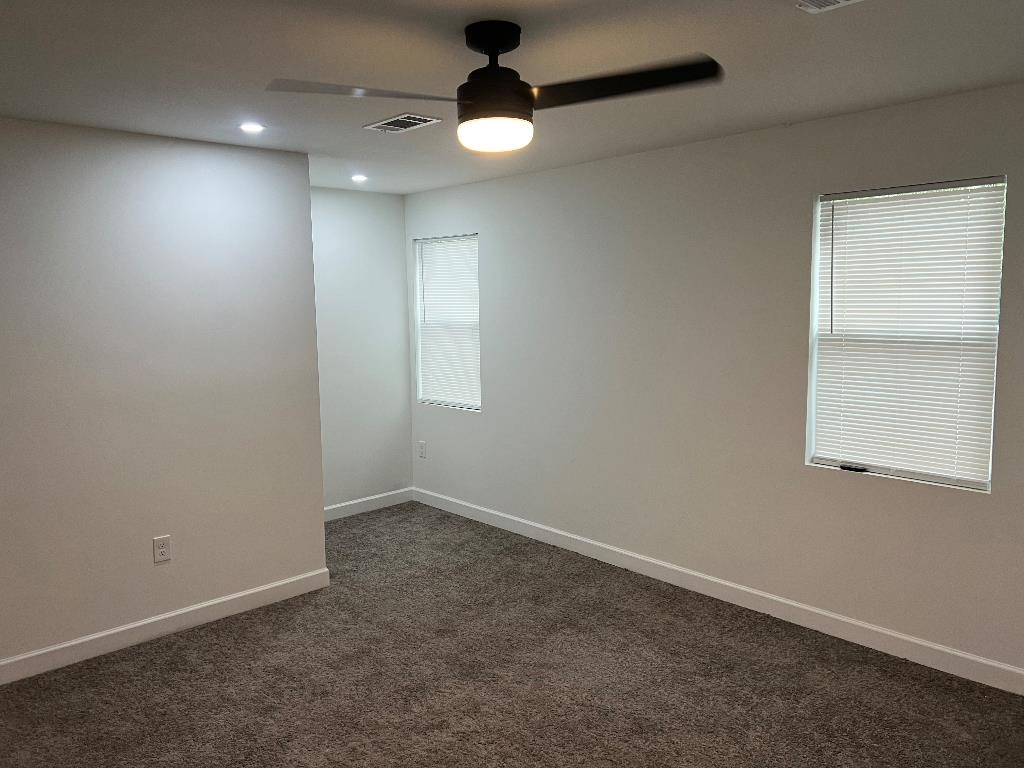 56 South Sanga Road Memphis, TN 38018 - Photo 11 of 23 Unfurnished room featuring dark colored carpet, a ceiling fan, and recessed lighting