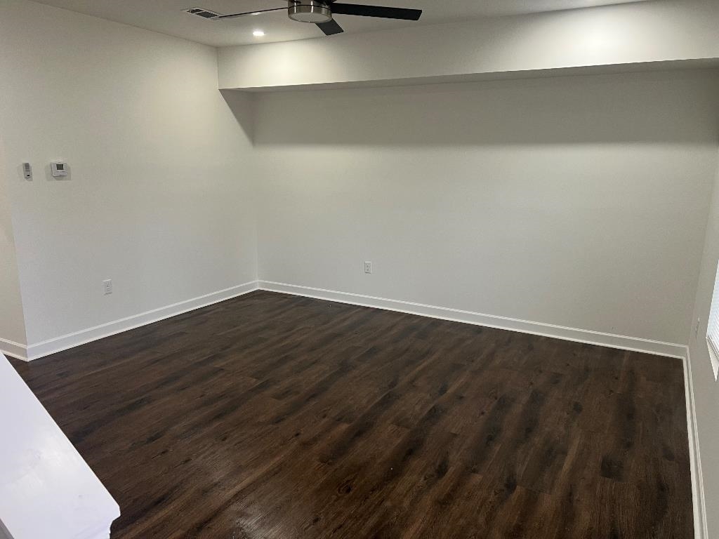 56 South Sanga Road Memphis, TN 38018 - Photo 16 of 23 Empty room featuring dark wood-style flooring, a ceiling fan, and recessed lighting