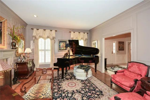 a view of staircase with railing and a potted plant