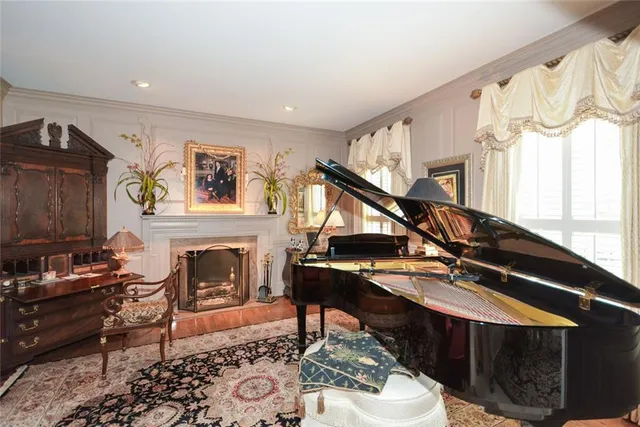 a bedroom with furniture and a flat screen tv
