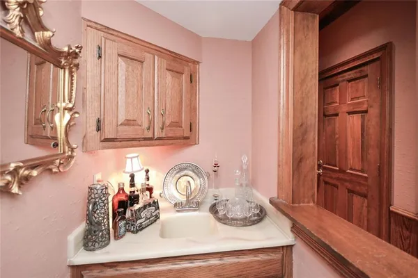 a spacious bathroom with a double vanity sink a mirror and shower
