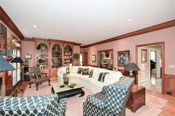 a spacious bathroom with a double vanity sink a mirror and a bathtub