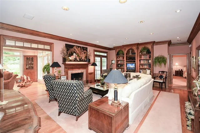 a dining room with furniture and a potted plant