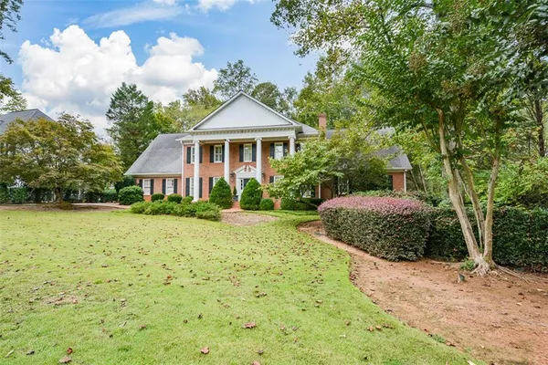 a front view of a house with a garage