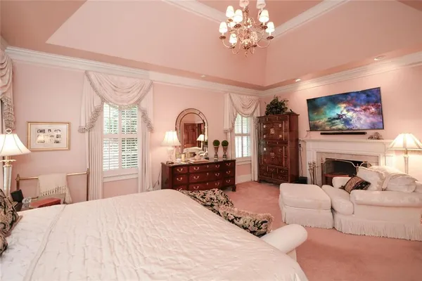 a living room with fireplace furniture and a fireplace