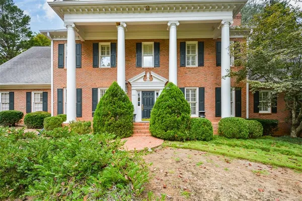 a vase of flowers sitting on a dining table