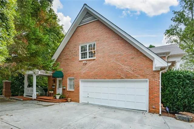 a kitchen with stainless steel appliances granite countertop a stove top oven a refrigerator a sink and dishwasher with wooden floor