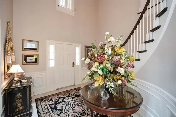 a living room with furniture a fireplace and a large window