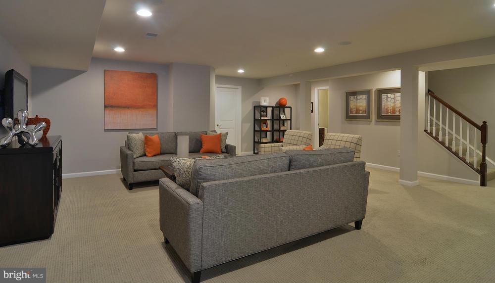 3142 Sunny Ridge Drive Odenton, MD 21113 - Photo 14 of 30 a living room with furniture and a flat screen tv