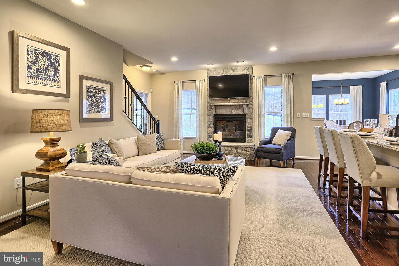 3142 Sunny Ridge Drive Odenton, MD 21113 - Photo 30 of 30 a living room with fireplace furniture and a flat screen tv
