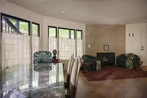 a bedroom with furniture and large windows