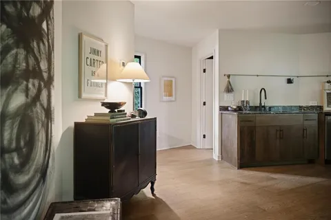 a kitchen with a refrigerator and a stove