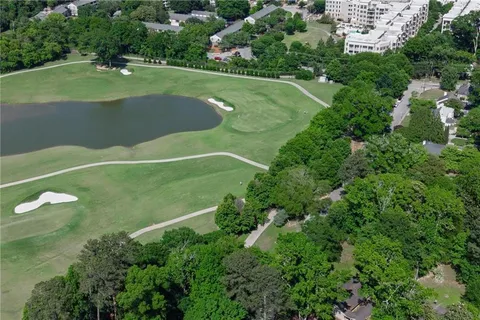 an aerial view of a houses with a yard