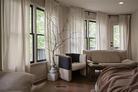 a living room with furniture and a window