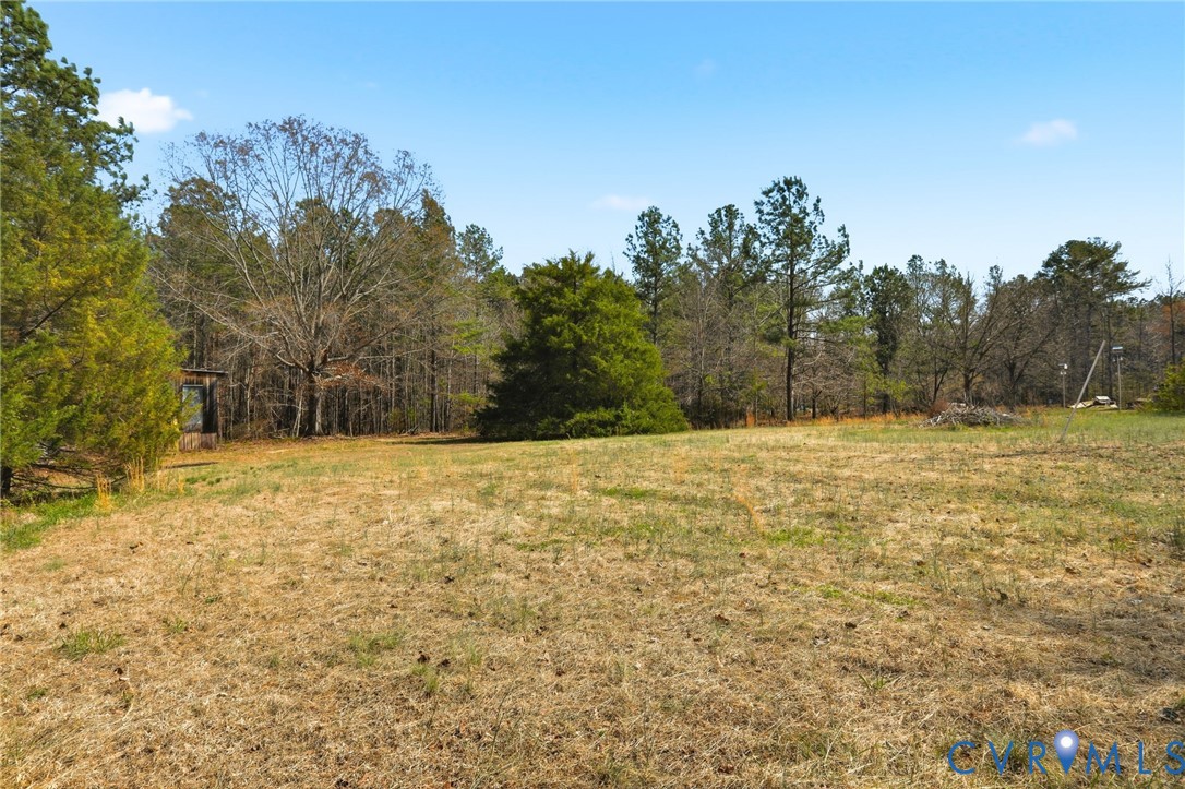 3490 Willow Brook Road Bumpass, VA 23024 - Photo 28 of 29 a view of a yard with trees in the background