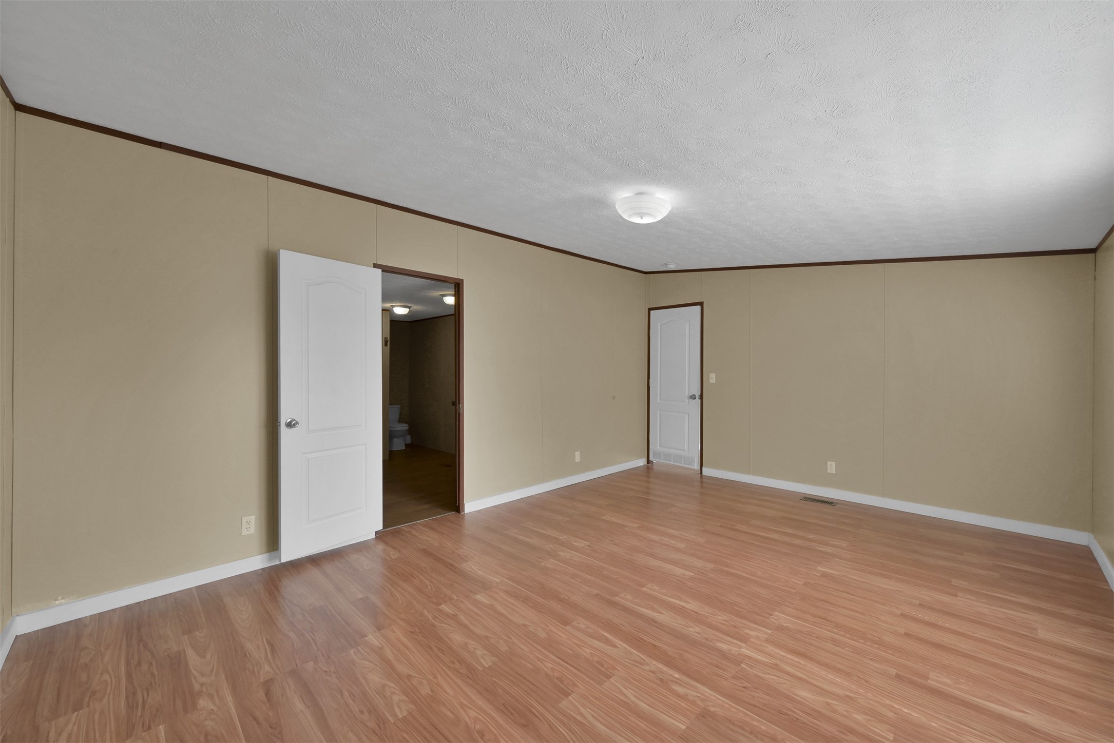 25414 T K C Road Tomball, TX 77375 - Photo 12 of 17 a view of an empty room with wooden floor