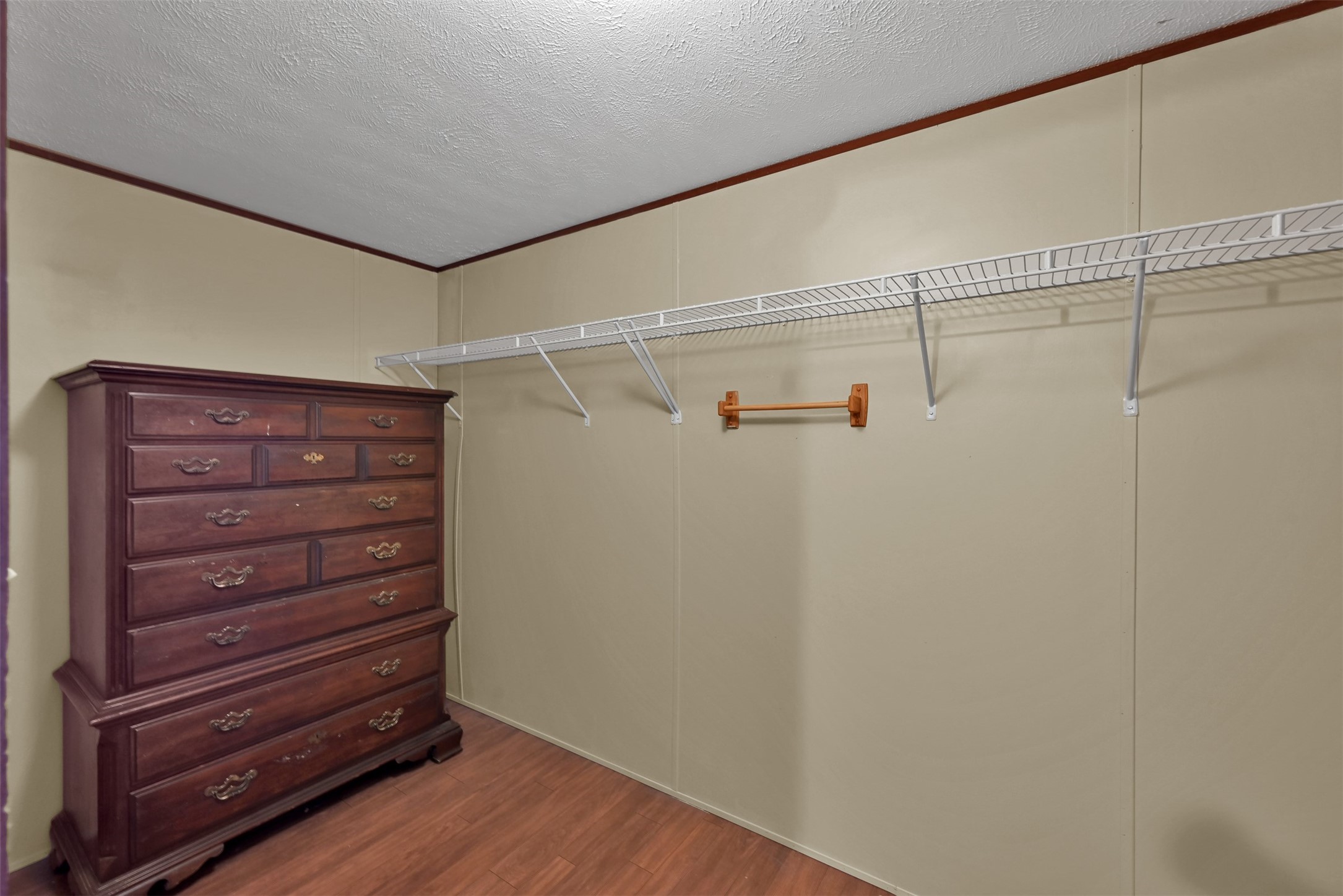 25414 T K C Road Tomball, TX 77375 - Photo 14 of 17 a view of walk in closet with empty racks