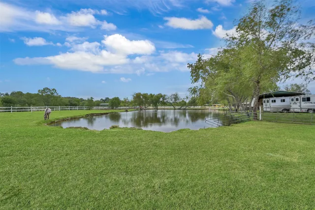 a view of a lake with houses in the back