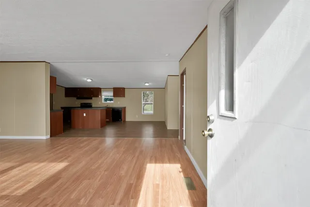 a view of a living room with a kitchen