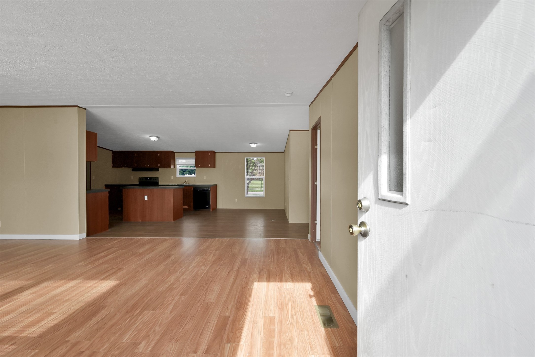 25414 T K C Road Tomball, TX 77375 - Photo 7 of 17 a view of a living room with a kitchen