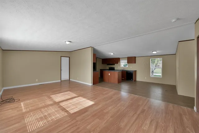 a view of a kitchen with a sink and a window