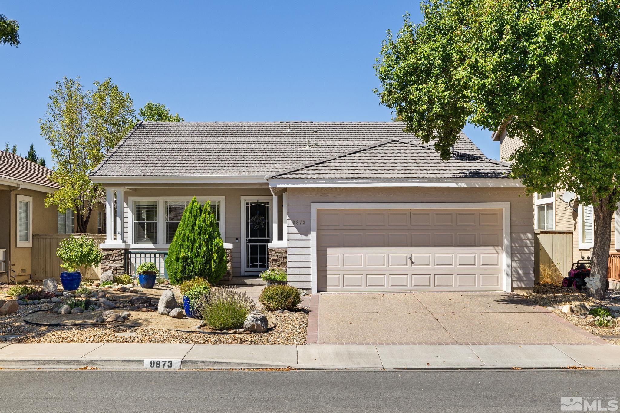 9873 Northrup Drive Reno, NV 89521 - Photo 1 of 24 a front view of a house with garden
