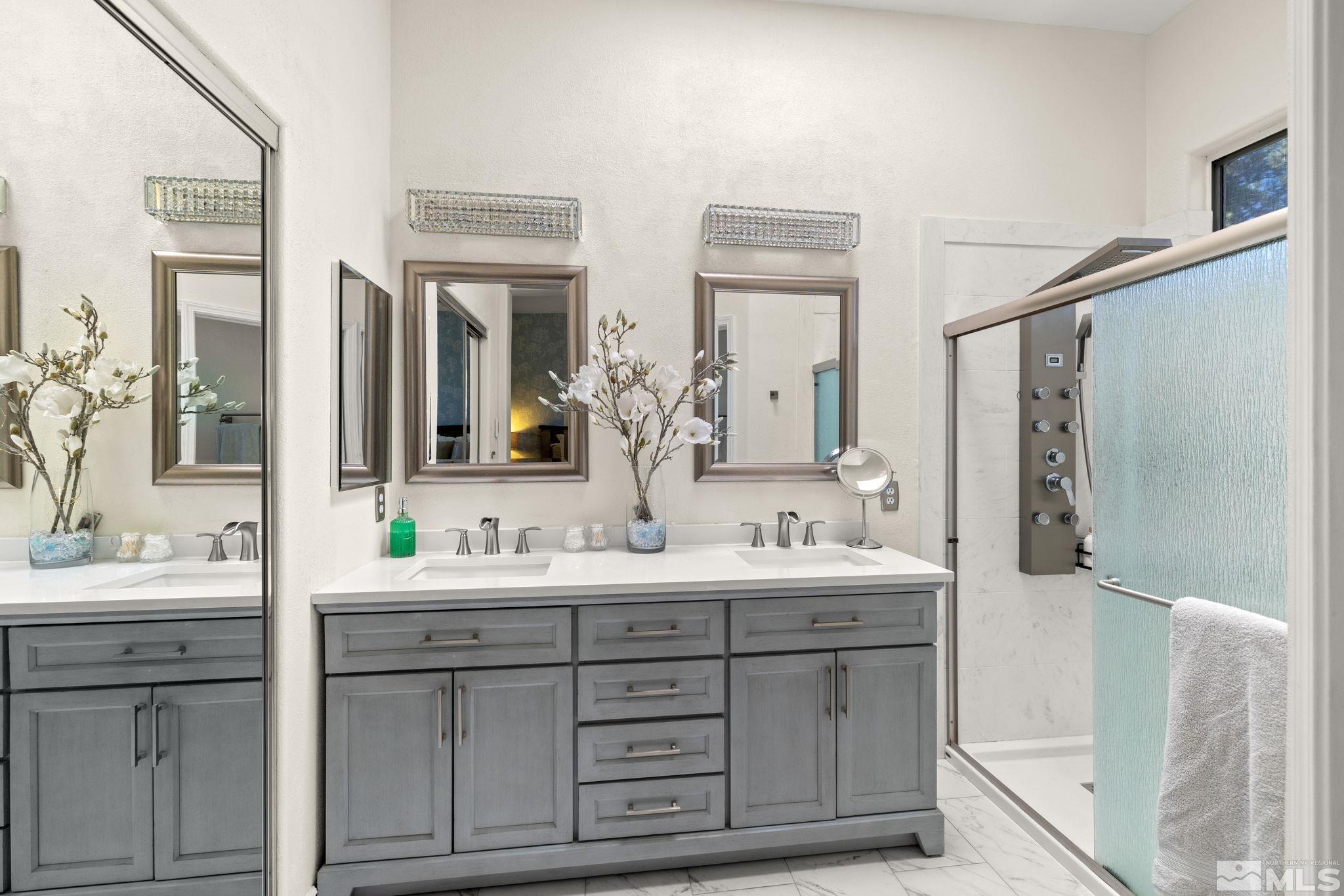 9873 Northrup Drive Reno, NV 89521 - Photo 14 of 24 a bathroom with a double vanity sink mirror and bathtub