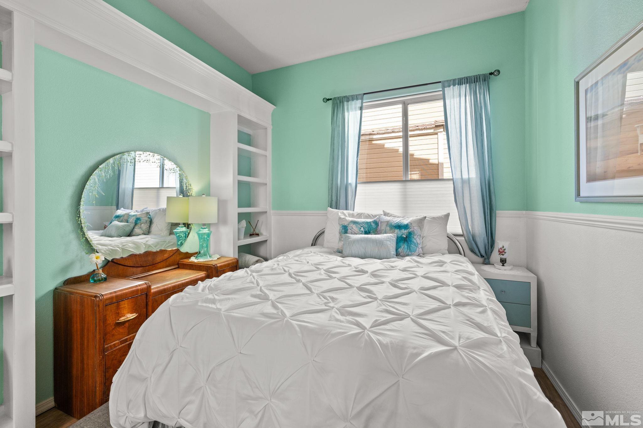 9873 Northrup Drive Reno, NV 89521 - Photo 16 of 24 a bedroom with a bed and a mirror