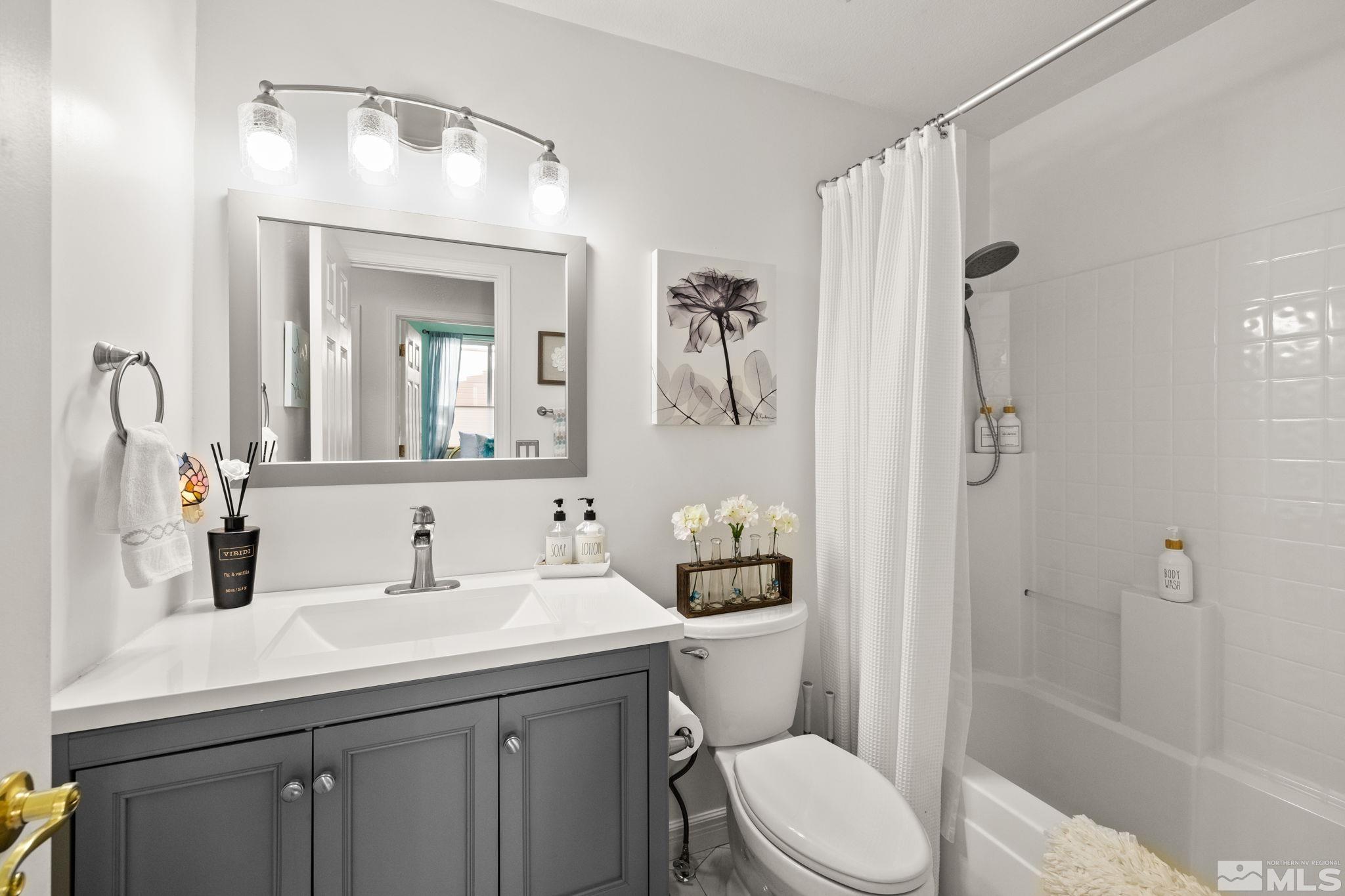 9873 Northrup Drive Reno, NV 89521 - Photo 17 of 24 a bathroom with a sink toilet and shower