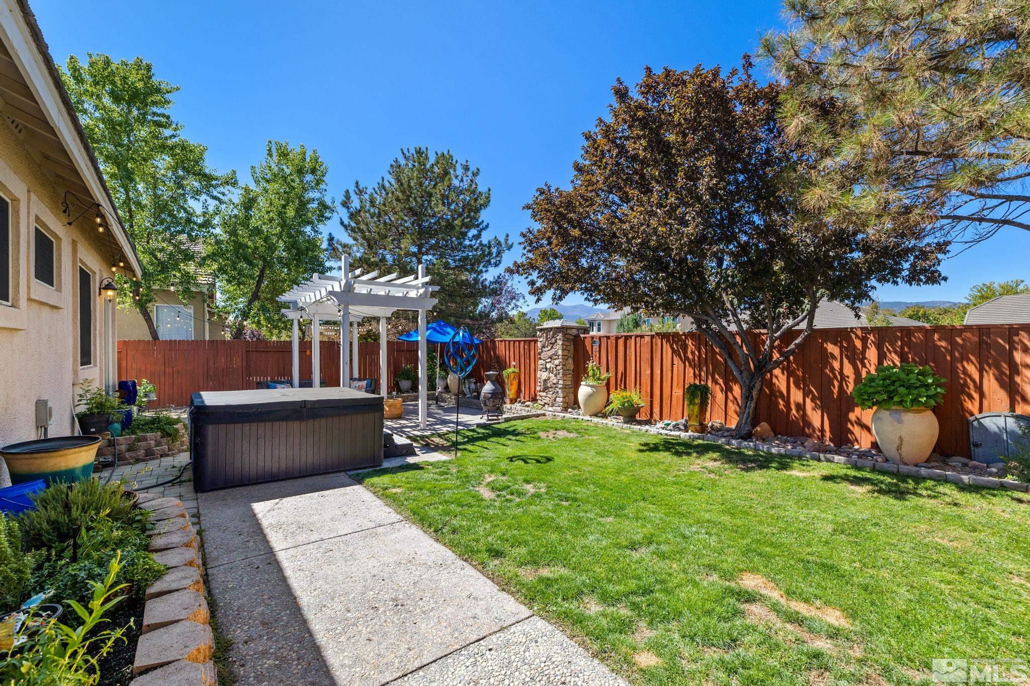 9873 Northrup Drive Reno, NV 89521 - Photo 22 of 24 a view of a garden with an tree