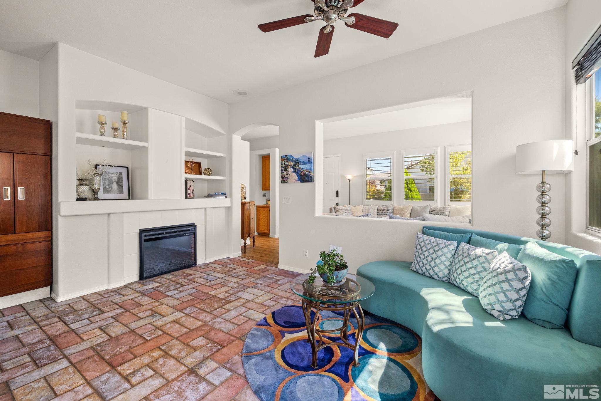 9873 Northrup Drive Reno, NV 89521 - Photo 5 of 24 a living room with furniture and a fireplace