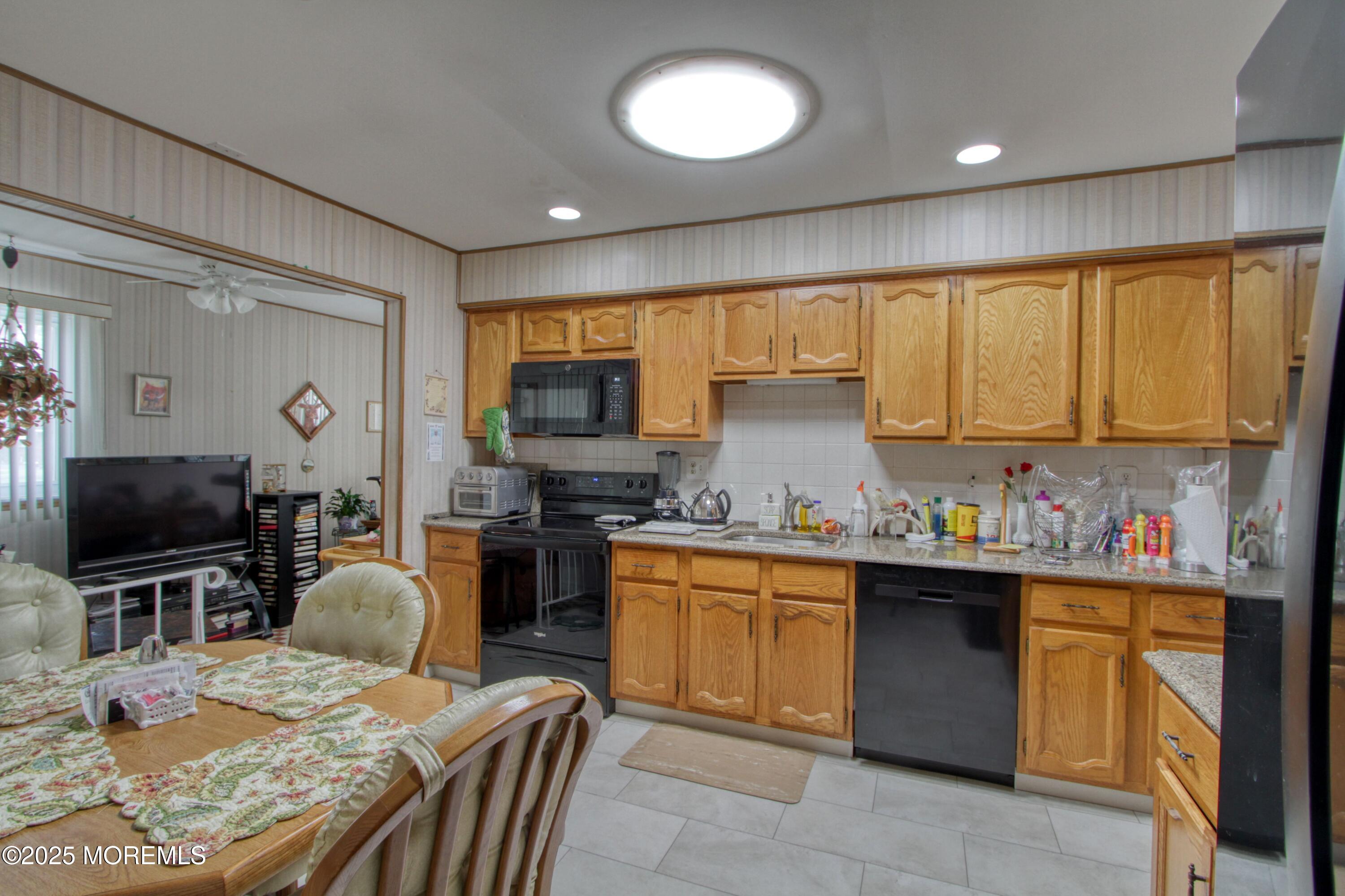 1 Amherst Road Whiting, NJ 08759 - Photo 3 of 34 a kitchen with a table chairs microwave and cabinets