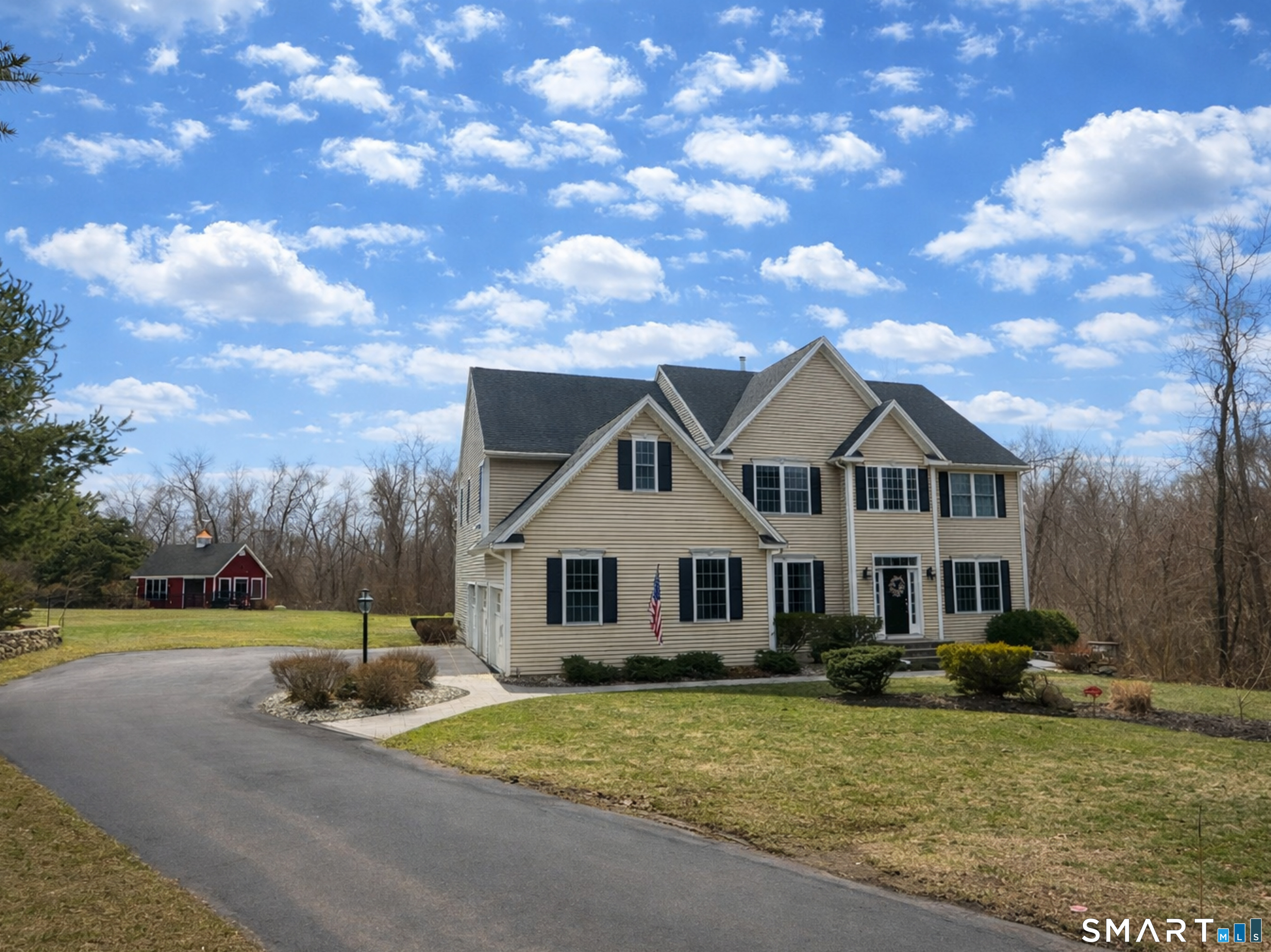 Privately set at the end of a cul-de-sac of fine homes, this rear-lot property offers space, privacy, and timeless curb appeal.