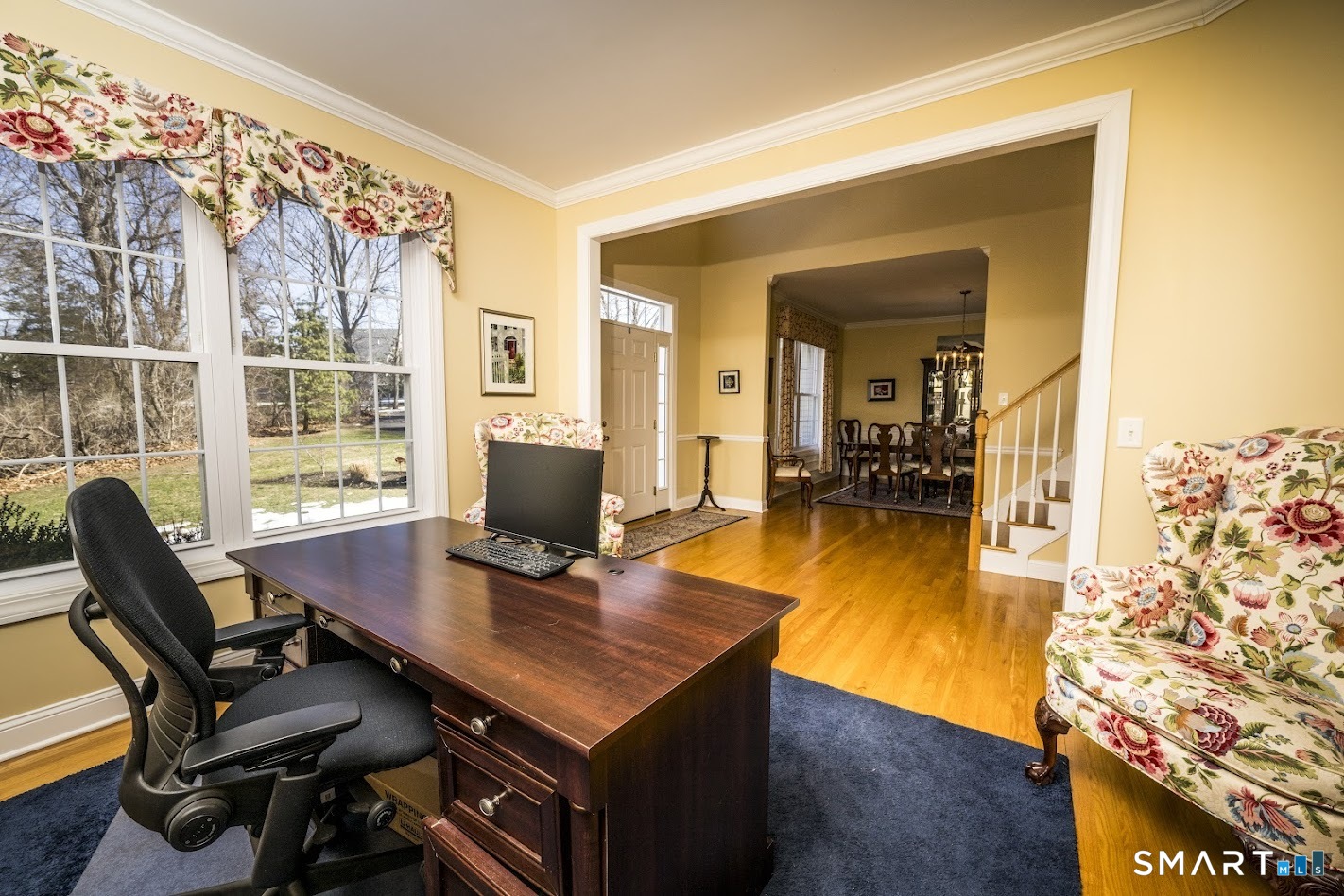 22 R Olde Yankee Way Durham, CT 06422 - Photo 11 of 29 Versatile formal living room off the foyer, currently used as a home office, featuring hardwood floors and large windows with abundant natural light.