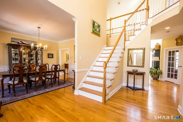 a view of dining room with furniture and wooden floor