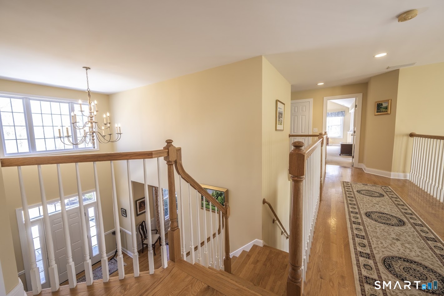 22 R Olde Yankee Way Durham, CT 06422 - Photo 15 of 29 Dual staircase design leading to the second floor with open upper landing overlooking the two-story foyer.